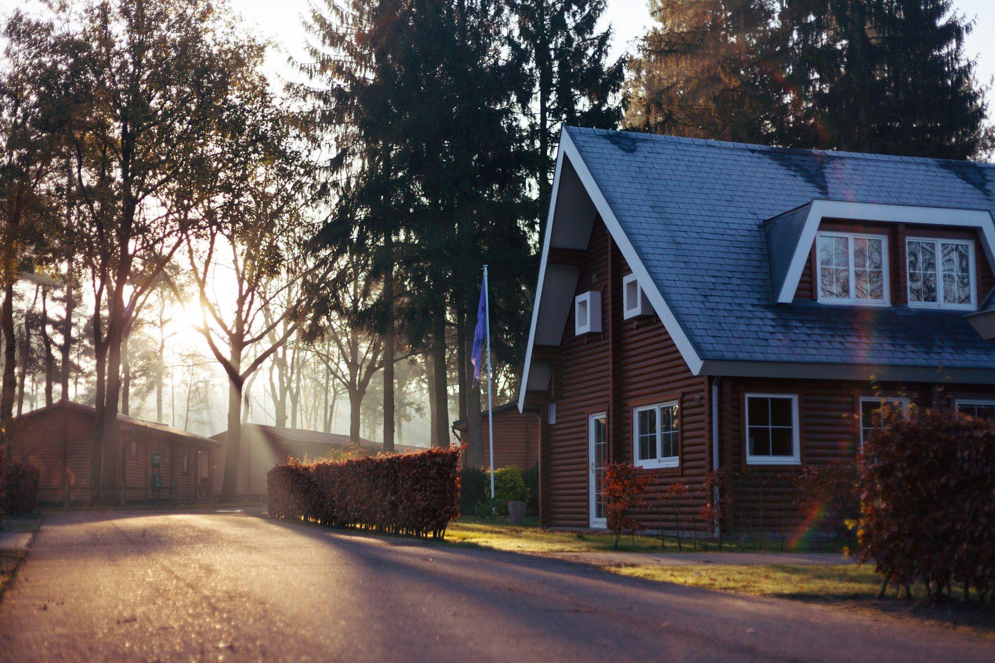 Brick home on a tree-lined Richmond street at sunrise